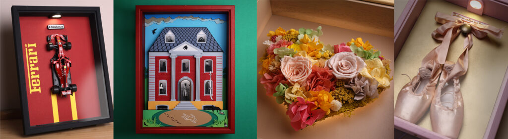 Illuminated art by Singular Luz featuring racing cars, paper art, preserved flowers, and ballet